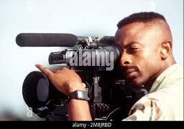 SSGT Dean Steele, video camerman from the 2nd Combat Camera Squadron, March  AFB, California documents the relief activities