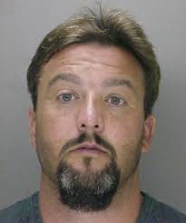 Swim instructor charged with theft