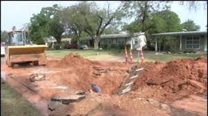 water dept. crews work to fix huge sinkhole