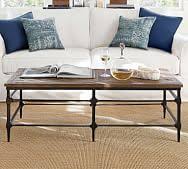 The tabletop is made from solid pine wood and has a butcher block style with visible wood grain and knots for a rustic, antique look. Glass Wood And Metal Coffee Tables Pottery Barn