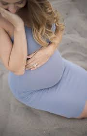 Considering cute maternity photo shoot ideas, try photographing a pregnant woman with her husband. 7 Tips For What To Wear To Your Maternity Shoot