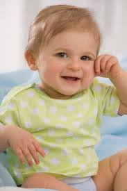 Baby girl (6-11 months) smiling, portrait stock photo