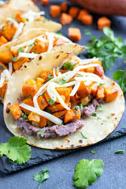 There are 442 calories in 1 serving of wahoo's fish taco black beans.: Black Bean Sweet Potato Tacos Vegetarian Evolving Table