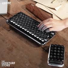 Presenting the stylish Lofree Dot Knight Edition mechanical keyboard. We've  got the complete set and it's up for preorder! This set consists of a shiny  metallic bluetooth keyboard, maus, palm rest and