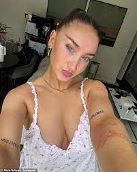 Love Island star Ayo Odukoya is seen with his new girlfriend who has a VERY  famous England football icon as a father after confirming their romance