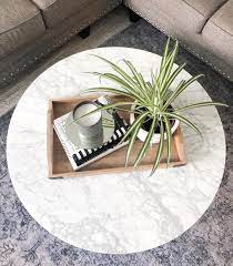 Set it on your table or counter and pair it with faux plants, pictures, and more for an adorable farmhouse look. 9 Chic Ways To Tackle Your Coffee Table Decor