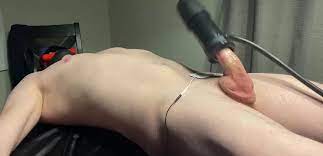 Tied up guys dick is milked with some special device - GotGayPorn.com