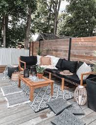 Pair boho room décor like wicker furniture with soft throw pillows in natural colors. A Cozy Bohemian Patio Rona