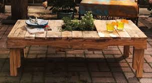 Garden table has a barn door as the table top, but other parts are made from recycled pallets. 11 Diy Pallet Patio And Garden Furniture Projects Shelterness