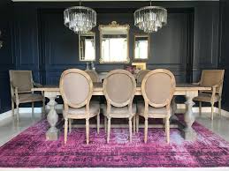 Also, make sure your rug has about 24 inches of extra room to prevent chairs from sitting unevenly or catching an edge when they're pushed in. Navy Dining Room With Pink Rug Transitional Dining Room San Diego By Jolig Interiors Designs Houzz