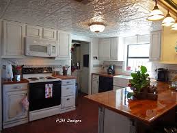 Kevin ritter of timeless kitchens pointed out valley tin works makes new tin ceiling tiles that he uses in his kitchen designs. Pjh Designs Kitschy Kitchen Tin Ceiling Tiles Kitchen Tin Ceiling Kitchen
