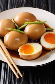 (per 2 eggs), 1 1/2 tbsp soy sauce, 1 1/2 tbsp mirin, 1/2 tbsp sugar. Nitamago Eggs In Soya Marinade With Green Onions Close Up In A Plate Vertical Stock Photo Image Of Chicken Menu 170296892