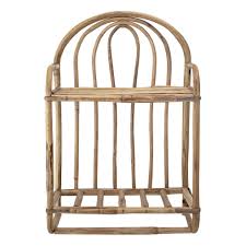 Place a table lamp on the surface, and stash your current read inside. Rattan Shelf Bloomingville Design Adult