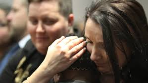 Smiles, hugs for families