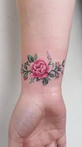 This small dainty rose flower covers the ring finger. 30 Delicate Flower Tattoo Ideas Tiny Rose Tattoos Wrist Tattoos Girls Tattoos For Women Flowers