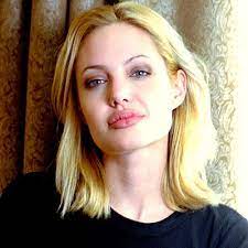 Here are some of her hairstyles which you could whether the star was a natural blonde or not is not known, but one thing is for sure, the natural brown color of hair that she sports most of the time, suits. Angelina Jolie S Changing Looks 1986 Angelina Jolie Blonde Angelina Jolie Hair Angelina Jolie 90s