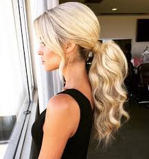 Low Wavy Voluminous Ponytail With Loose Front Strands Hair Color For Black Hair Medium Hair Styles High Ponytail Hairstyles