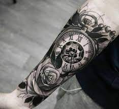 Realistic clock tattoo on left half sleeve. 21 Gorgeous Clock Tattoo Ideas For Men Styleoholic