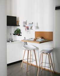 Wooden floor with white chairs and farmhouse kitchen tables for small kitchen ideas. 25 Small Yet Stylish Breakfast Bar Ideas Shelterness