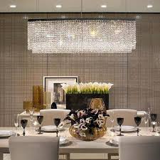 A general rule of thumb is to hang the fixture 3 feet (36 inches) above your table or 6 feet (72 inches) off the floor. Rectangular Raindrop Crystal Pendant Light In 2021 Crystal Chandelier Dining Room Dining Room Lighting Chandeliers Dining Room Light Fixtures
