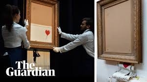 Banksy has played what could be one of the most audacious stunts in art history, arranging for one of on saturday evening, banksy posted a video on his instagram page which showed a shredder being fitted to the frame of the painting. Banksy Video Shows Plan To Shred Entire Girl With Balloon Artwork Banksy The Guardian