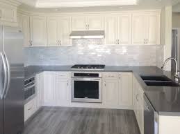 Antique White Kitchen Cabinet With Grey Quartz Countertop Undermount Sink And Pul Antique White Kitchen Antique White Kitchen Cabinets White Kitchen Cabinets