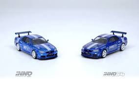 Scale: 1.64 Model: Nissan Skyline GT-R R34 V-Spec Brand: Inno64 Release  Date: November 2024 Material: Diecast Colors: Blue with White stripes.  Chrome Blue with White Stripes (Chase Version) Details: Tokyo Auto Salon
