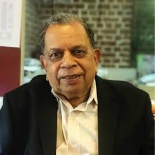 Myself lighting JPF lamp of wisdom with Mr R K Damani, Chairman