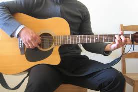 Simply slide the pick in between the thumb and the outer edge of the index finger, so that the index finger is pointing down toward the tip of the pick without poking out beyond it. How To Hold A Guitar Beginner Guitar Lessons Music Experts