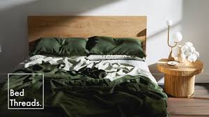 A bed made with linen sheets — the strategist reviews the best linen bedsheets. Olive Sage Pinstripe Bed Threads Youtube