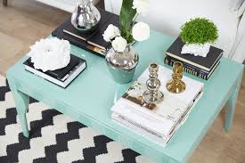 A simple vase of flowers or a moss topiary adds an instant pop of color and style, and it's easy to change with the seasons. Interior Inspiration How To Dress A Coffee Table Danetti