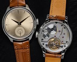 A Cambodian watchmaker meticulously working on a complex watch movement