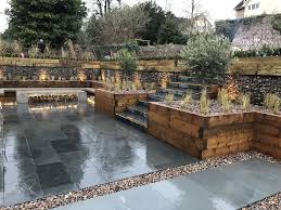 Beautiful Multi Level Garden By Tranquilo Landscapes In Bristol U K Polished Concrete Fi Landscaping Retaining Walls Concrete Retaining Walls Concrete Patio
