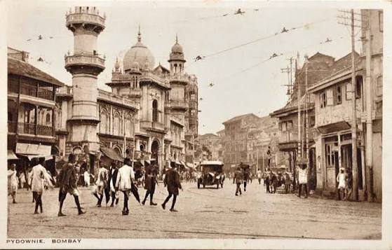 Street Scenes In British Era Bombay – 4 Postcards 1900s Five postcards that date from the 1900s show street scenes in British Era Bombay (Mumbai). The first postcard is of Medows Street