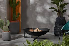 A gas fire pit table, in the simplest terms, is a portable propane gas tank connected to a burner in a concave bowl or basket in the middle of a very stylish table meant to provide warmth in your patio or backyard. Best Outdoor Fire Pits For Your Garden 2021 Evening Standard