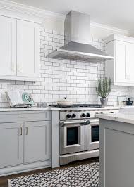 White Cabinets Grey Subway Tiles Design