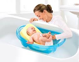 Happy mother smiling near toddler son in plastic baby bathtub. Bath Foam Support For Babies Www Macj Com Br