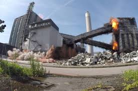 A football match taking place in rugeley, staffordshire, was interrupted by the controlled demolition of four chimneys at a power station in the town. News Brown And Mason