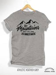 The Mountains Are Calling And I Must Go T Shirt The Mountains Are Calling And I Must Go T Shirt Women S Racerback Tank Unisex Crewneck Tee Graphi With Images Womens Racerback Tank Quality T Shirts Stylish Tee