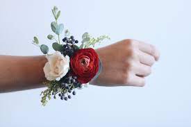 Fun Wrist Corsage With Ranunculus And Privet Berry Whim Florals Privet Berries Ranunculus Boutonniere Wedding