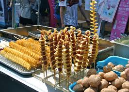 Potatoes Swirled Around Hot Dogs Street Food Seoul S Korea Sadly I Didn T Try This Have To Go Back Dog Food Recipes Korean Food Food