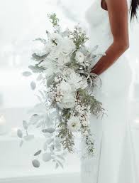 Winter wedding bouquets bride white and light pink flowers. A New Kind Of Wintry Mix Monochromatic White Wedding Winter Wedding Bouquet Wedding Bouquets Wedding Flower Arrangements