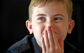 Born without hearing, an 11-year-old takes