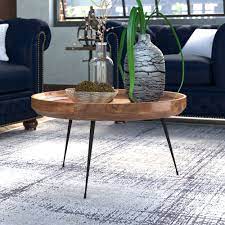 The urban port round mango wood coffee table with splayed metal legs, brown and black. Industrial Lodge Home Annabel Round Mango Wood Coffee Table Reviews Wayfair Ca