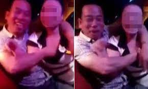 Leaked video shows Chinese official fondling woman's breasts | Daily Mail  Online