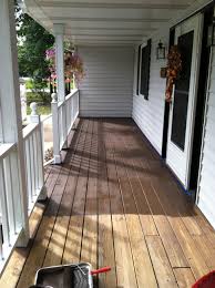 What is the easiest method to paint/stain around the bottom of the balusters (where white meets brown)? Behr Deck Over In Padre Brown Porch And Patio Paint Deck Paint Painted Patio