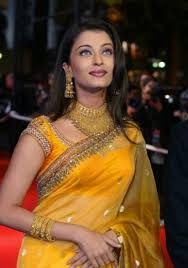 In a gorgeous saree at the foundation for aids research gala, she drapes a shimmering dupatta over a shoulder. Aishwarya Rai Yellow Saris Hq Photos Wallpapers Aishwarya Rai Hd Wallpapers Download Indian Celebrities Indian Actresses Fashion