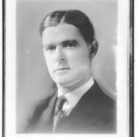 John Flynn's tombstone, bearing the epitaph he requested: "God rest his  soul