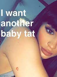 Kylie Jenner Unveils New Red Script Tattoo On Her Bicep Kylie Jenner Piercings Barbie Tattoo Heart Tattoo