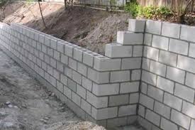 A retaining wall is a practical outdoor feature that can help keep your yard in top form, but it's often overlooked—or misunderstood. Construction Of Concrete Block Retaining Walls With Steps